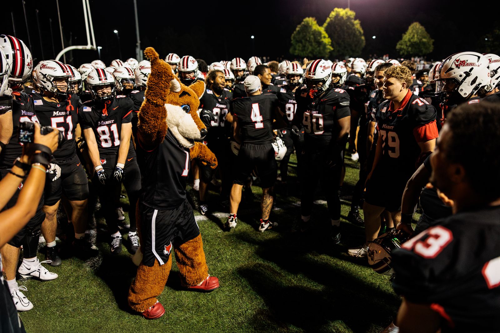 Football: The Marist football team gathers before its season opener against Franklin Pierce — photographed by Michael LaCroix-Fralish for 845 Sports Rewind