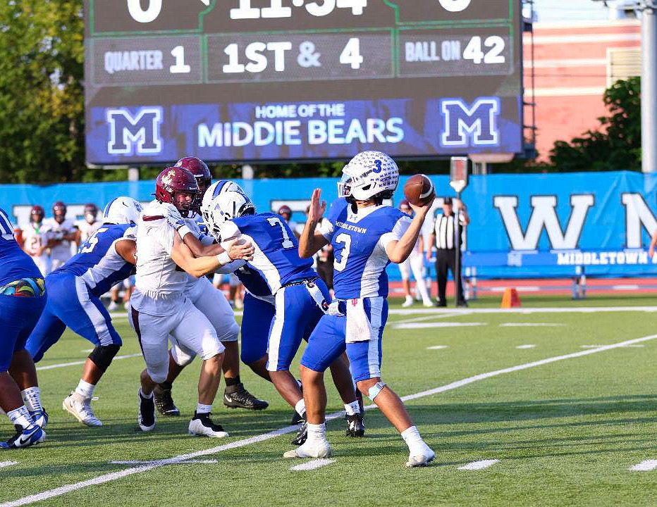 Football: Middletown quarterback Joseph "JoJo" Royal drops back to pass against Arlington — photographed by Bret B. for 845 Sports Rewind