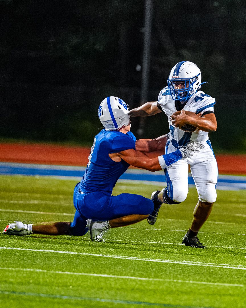 Football: Valley Central breaks a tackle attempt against Wallkill — photographed by Tim Reynolds for 845 Sports Rewind
