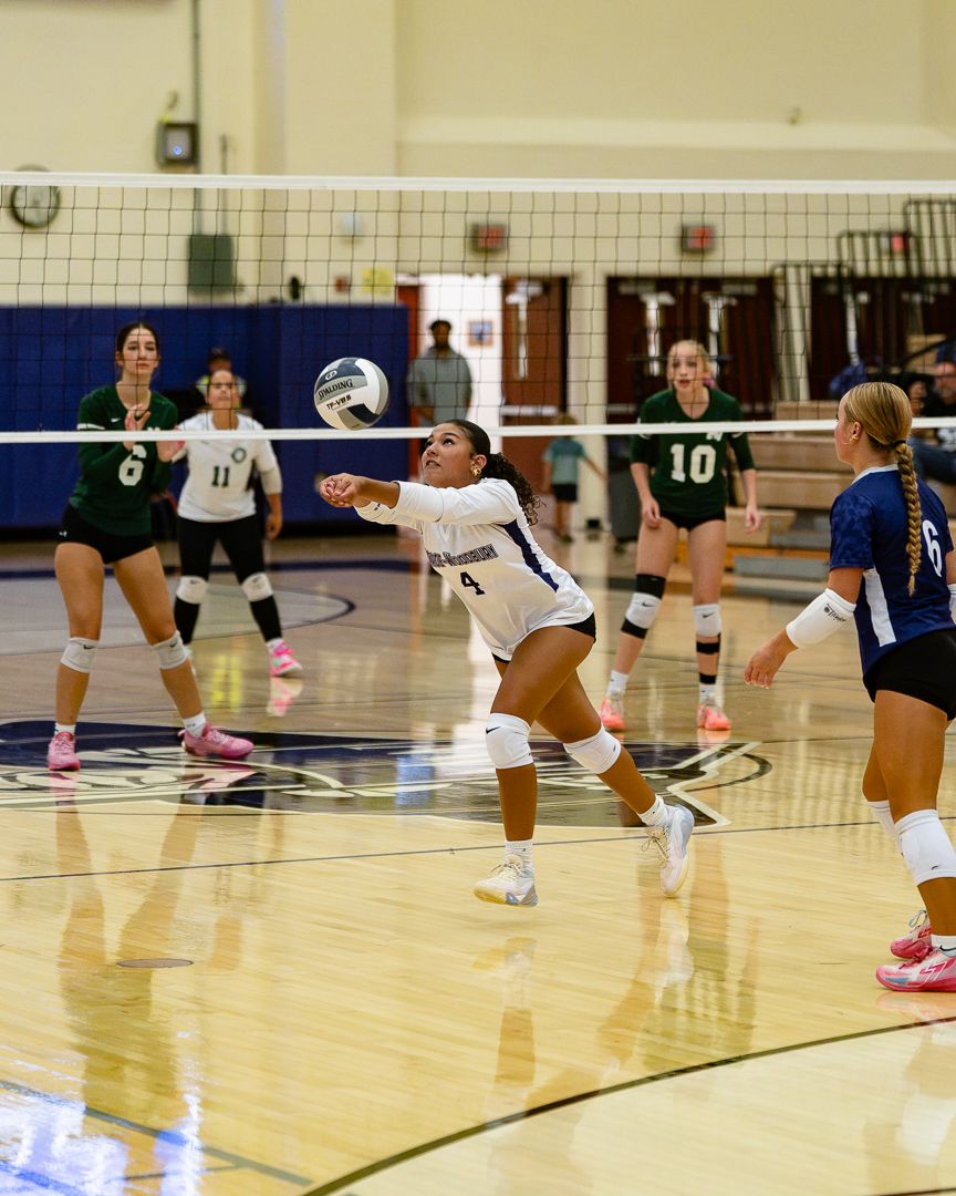 Volleyball: Monroe-Woodbury digs a ball against Minisink Valley — photographed by 845 Sports Rewind Staff