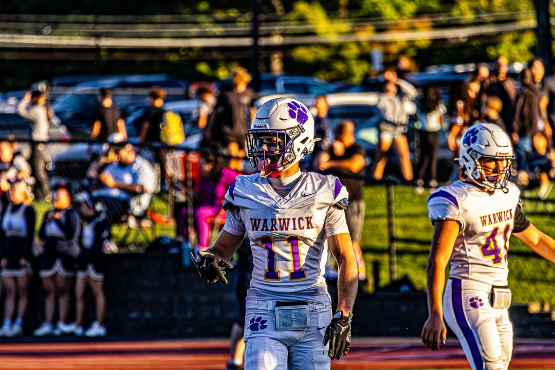 Football: Warwick players head back to the huddle at Pine Bush — photographed by Chase Plowden for 845 Sports Rewind