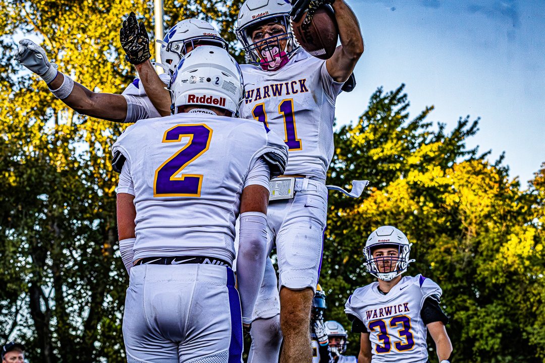 Football: Warwick players celebrate after a big play at Pine Bush &mdash; photographed by Chase Plowden for 845 Sports Rewind
