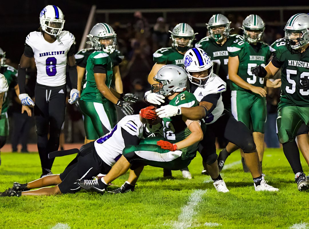 Football: Middletown defenders bring down a Minisink Valley ball carrier &mdash; photographed by Bret B. for 845 Sports Rewind
