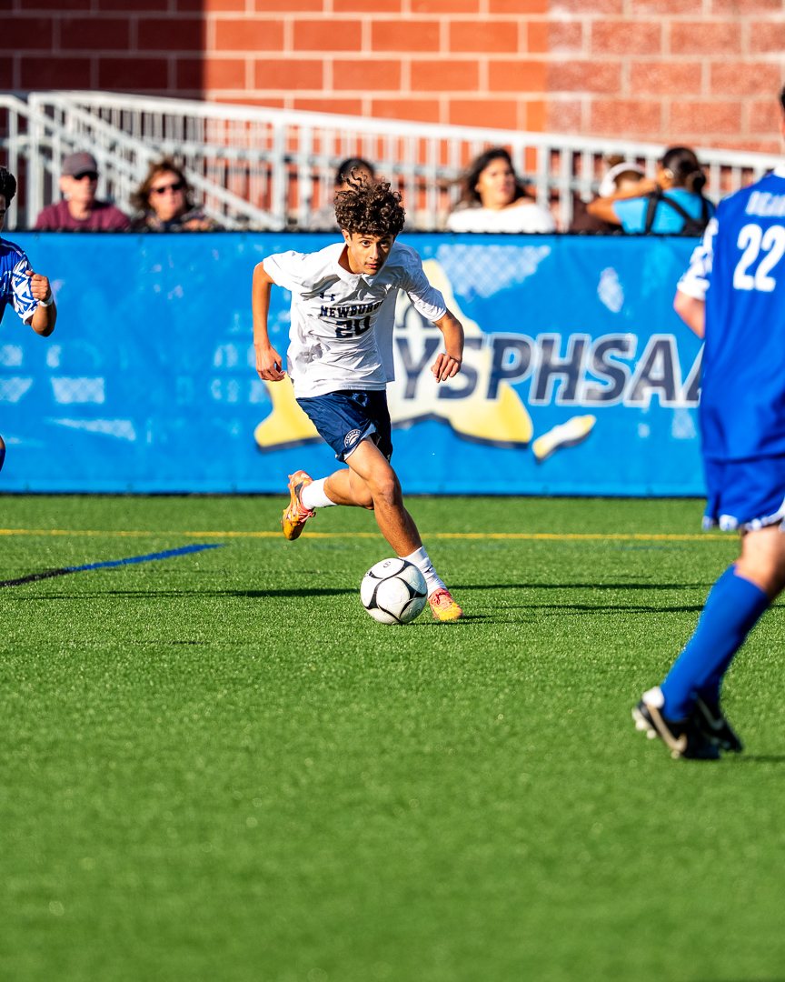 Boys soccer: A Newburgh midfielder carries the ball into the attack &mdash; photographed by 845 Sports Rewind Staff