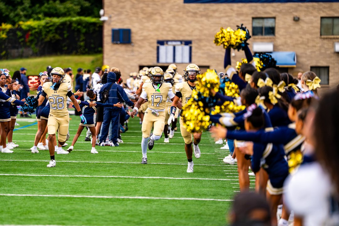 Football: Newburgh Free Academy’s Nos. 17 and 28 run onto the field as the Goldbacks are introduced before Friday’s game against Cornwall at Newburgh — photographed by 845 Sports Rewind Staff for 845 Sports Rewind