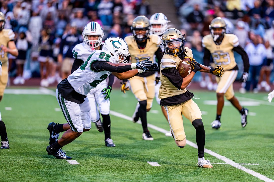 Football: Newburgh Free Academy&rsquo;s No. 15 carries the ball as Cornwall&rsquo;s Derek Scott (28) moves in for the tackle at Newburgh &mdash; photographed by 845 Sports Rewind Staff for 845 Sports Rewind