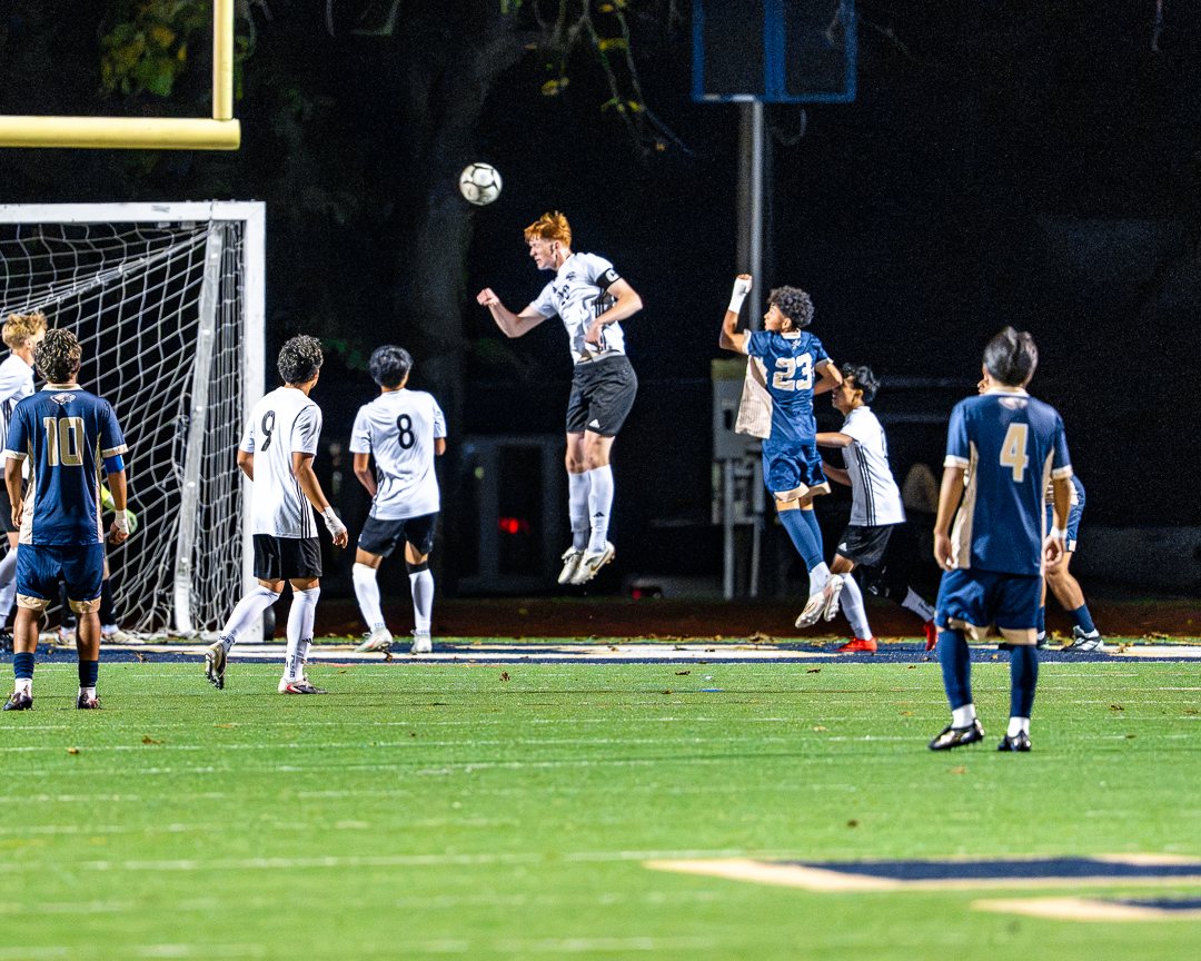 Boys soccer: A Monroe-Woodbury player rises to head the ball in front of the Newburgh Free Academy goal — 845 Sports Rewind staff photo