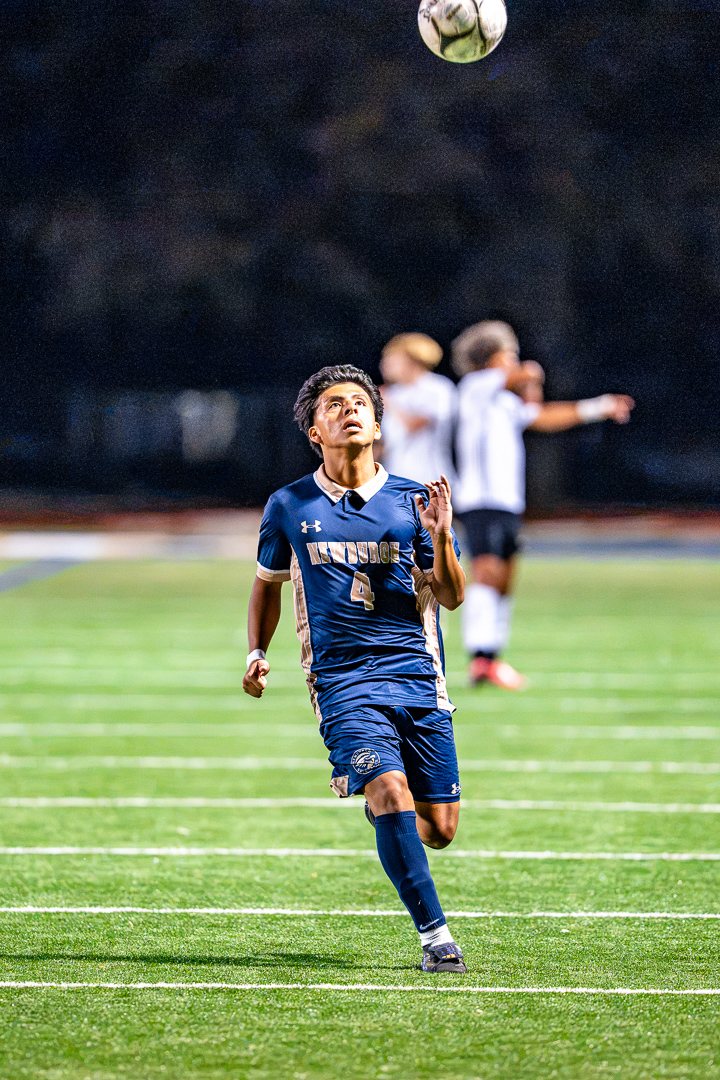 Boys soccer: Newburgh Free Academy’s No. 4 tracks a ball in the air against Monroe-Woodbury — 845 Sports Rewind staff photo