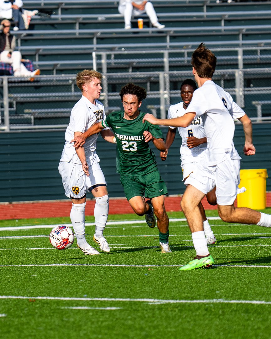 Boys soccer: Cornwall&rsquo;s No. 23 drives into traffic between three Lourdes defenders &mdash; 845 Sports Rewind staff photo